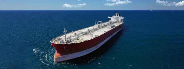 Aerial drone ultra wide panoramic photo of crude oil - chemical tanker ship cruising Mediterranean...