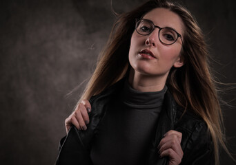 Close-up shot of a young attractive woman in her mid 20s - studio photography