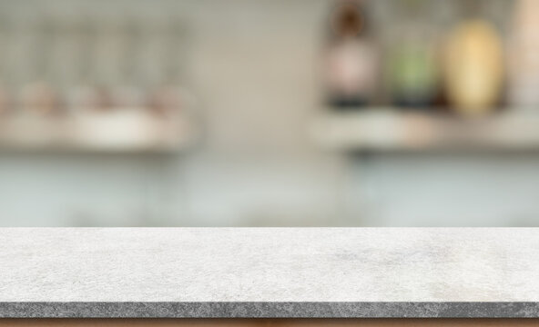 Empty White Marble Stone Table Top And Blur Interior Cafe And Restaurant.