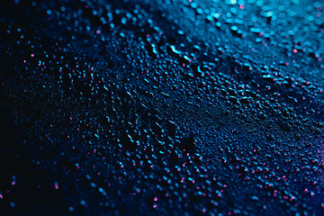 rainfall and moisture over a metal surface at night. cyber colours, defocused background, bokeh...