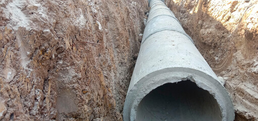 Cement pipe in the excavated trench