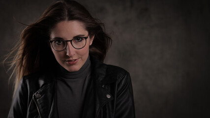 Close-up shot of a young attractive woman in her mid 20s - studio photography