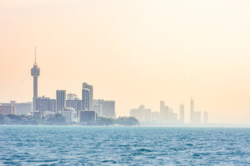 Fototapeta premium view from water of a Thailand city and the blue sea with sunlight