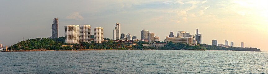 view from water of a Thailand city and the blue sea with sunlight