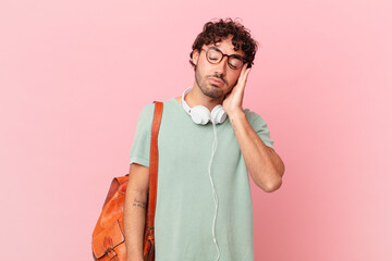 hispanic student feeling bored, frustrated and sleepy after a tiresome, dull and tedious task,...