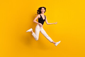Fototapeta na wymiar Full body profile side photo of young excited girl happy smile jump imagine play guitar isolated over yellow color background