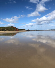Clouds reflected on beach at Phillip Island, Melbourne, Australia