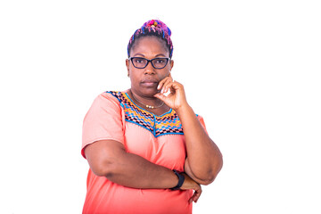 pensive adult woman crossing down with raised hand under chin.