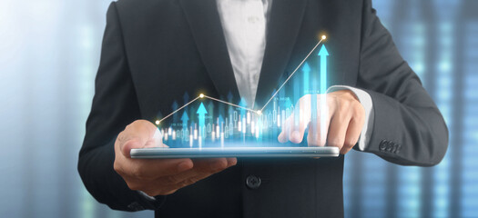 Businessman plan graph growth and increase of chart positive indicators in his business