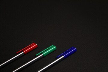 red, green and blue pens