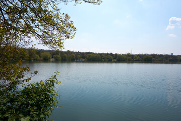 panorama shot of the beautiful max-eyth-see lake in stuttgart under blue sky and sunshine