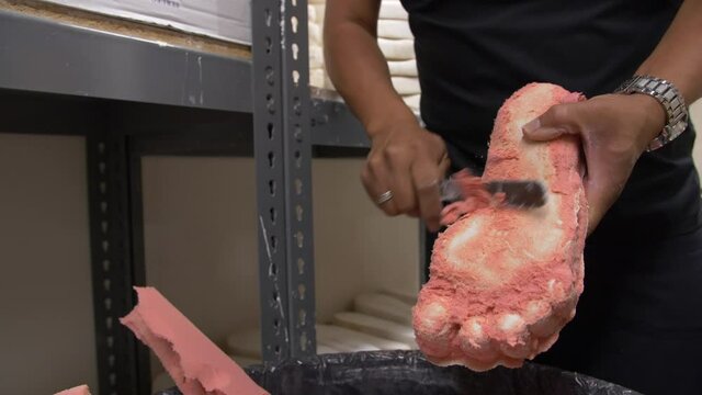 Creating a custom shoe insert at the foot clinic.