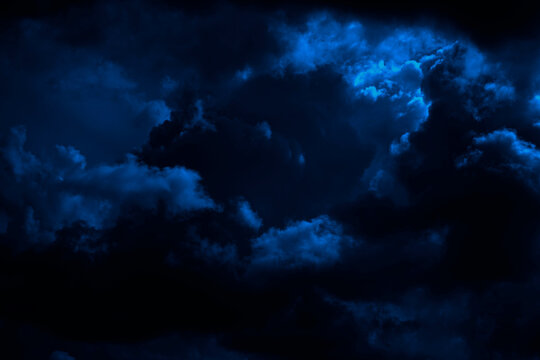 Dark blue sky. Thunderclouds. Dramatic sky background with copy space for design. Web banner. Epic scene. Majestic, magical, creepy, fantastic, horror, mystical.