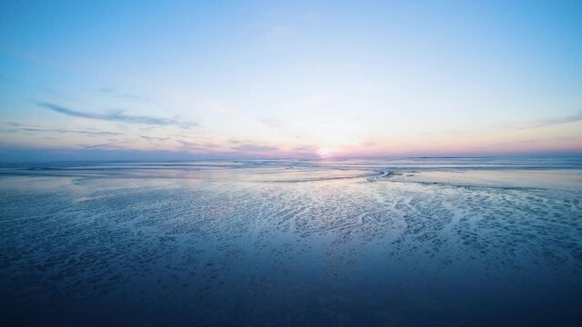 drone flight over the north sea after sunset