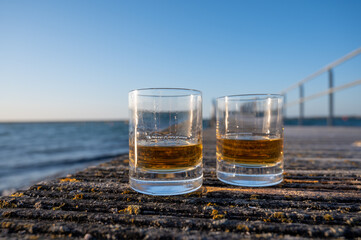 Drinking single malt Scotch whisky at sunset with sea, ocean or river view, private whisky tours in Scotland, UK