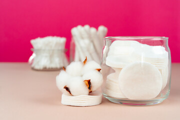 Cotton discs for skincare in a jar on paper background