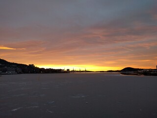 sunset by the docks in the city in the winter