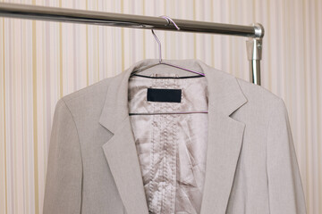 business gray jacket on a hanger 