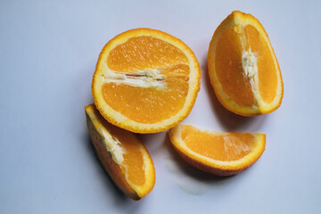 Fototapeta na wymiar bright orange sliced oranges lie on the table 