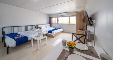 Luxury Interior living room with sofa bed and bed queen size, Dining table,air conditioner, and furniture, Studio room type of condominium or apartment, service apartment and Accommodations Concept