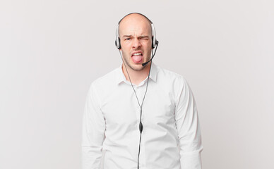 telemarketer feeling disgusted and irritated, sticking tongue out, disliking something nasty and...