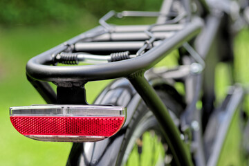 Close-up of red reflector back on a bicycle - 429426002