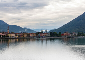 View of Porlezza city during summer cloudy day evening over Lugano lake in Italy.