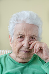 potrait of an old sad woman crying