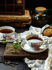 Fototapeta na wymiar cup of tea and cookies on wooden table