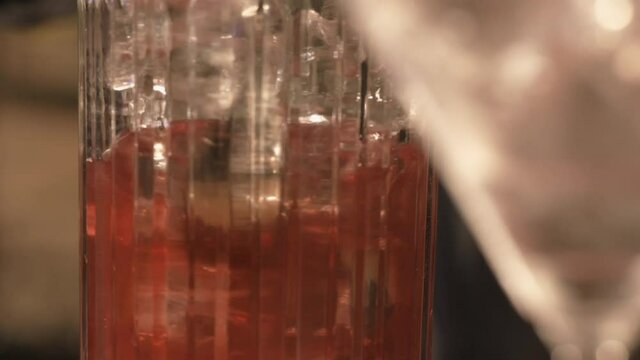 professional bartender makes a cocktail in a nightclub. shaker. slow motion. close up