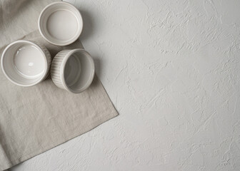 Empty ramekin on burlap, food photo preparation.