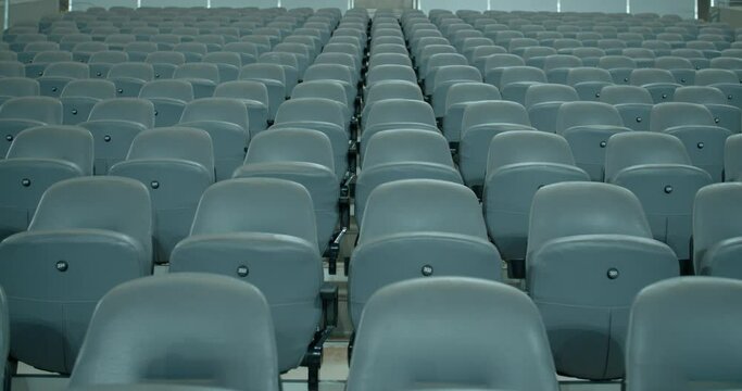 Empty event stadium seat rows during quarantine lockdown, static view