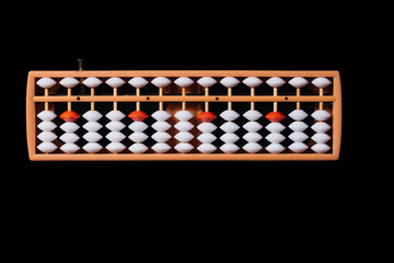 Japanese traditional abacus soroban on black background.