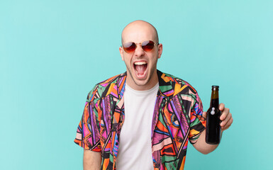 tourist with beer tourist man shouting aggressively, looking very angry, frustrated, outraged or...