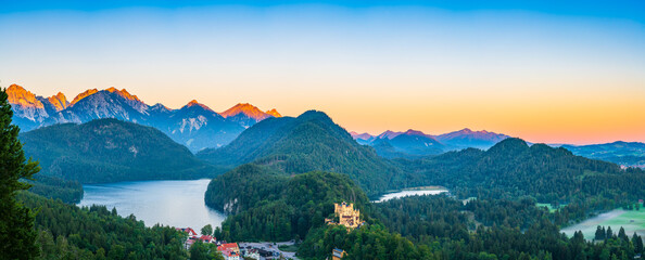 Beautiful sunrise panorama of Alpsee with Schwarzeberg mountains, southwest Bavaria, Germany