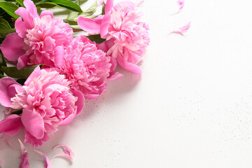 Bouquet of pink peony flowers on white. Copy space. Cloae up. Greeting card with peony for Women's day or Mothers day.