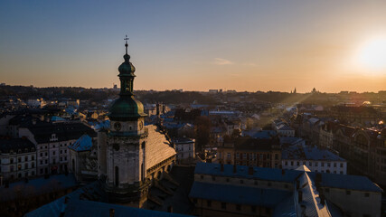 Obraz premium aerial view of sunset above old european city. church bell tower