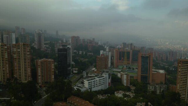 Backwards Aerial View of Medellin, Colombia on Gray Afternoon