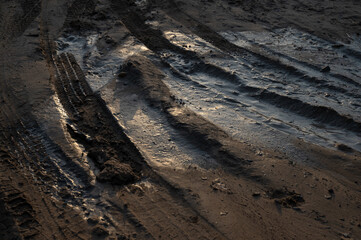Rural muddy dirt road in the sun after rain