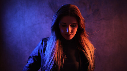 Strong colorful portrait shot of a young woman - studio photography