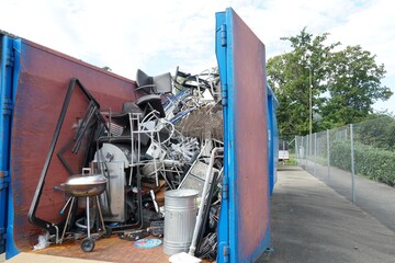 Miscellaneous and mixed metal waste collected in a container in a community disposal place. A...