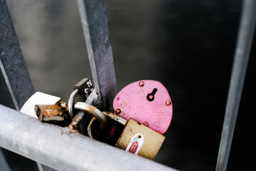 a bunch of locks that are left on bridges by couples in love. The emphasis is on old age, the strength of the bonds that the lock symbolizes.