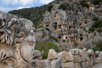 Obraz premium Ancient lycian Myra tombs and woman's stone face in Turkey, Demre