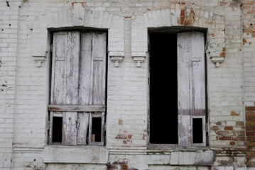 vintage wooden shutters of a dilapidated house