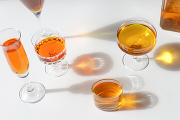 Reflections of glasses with orange drink and bottle with logo Holland to celebrate King's Day .