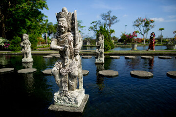 Fototapeta na wymiar Statues in the balinese temple of Tirta Gangga