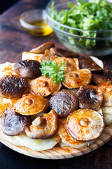 Potatoes and shiitake mushrooms in the style of octopus a feira. typical Galician dish. Vegan adaptation of the octopus to Galician feira. Food photography