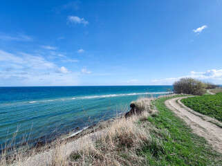 Fototapeta na wymiar Landscape of blue Baltic sea with white sand in north Germany