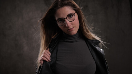 Photo shooting with a young attractive woman in a studio - studio photography