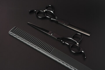 Gray Comb And Black Scissors On A Dark Background. Professional Hair Tools. Minimalist Style